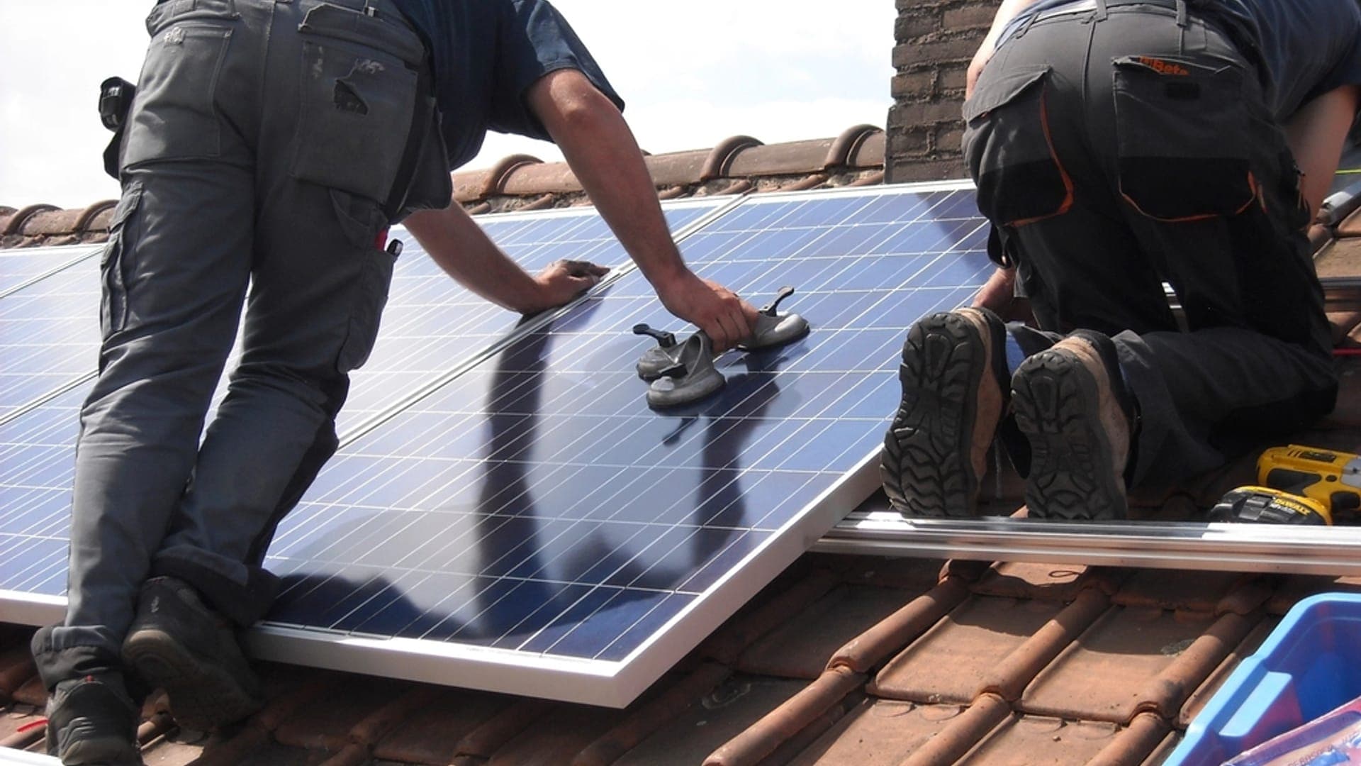 Engineers installing solar panels